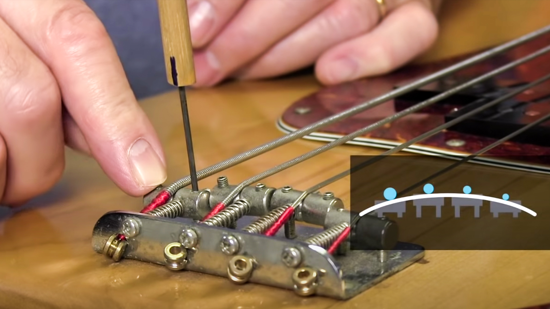 Fixing fret buzz: raising the saddles