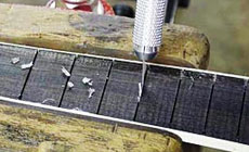 Photo: cleaning the fret slots