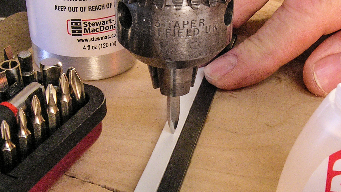 Installing side dots with the help of plywood scraps