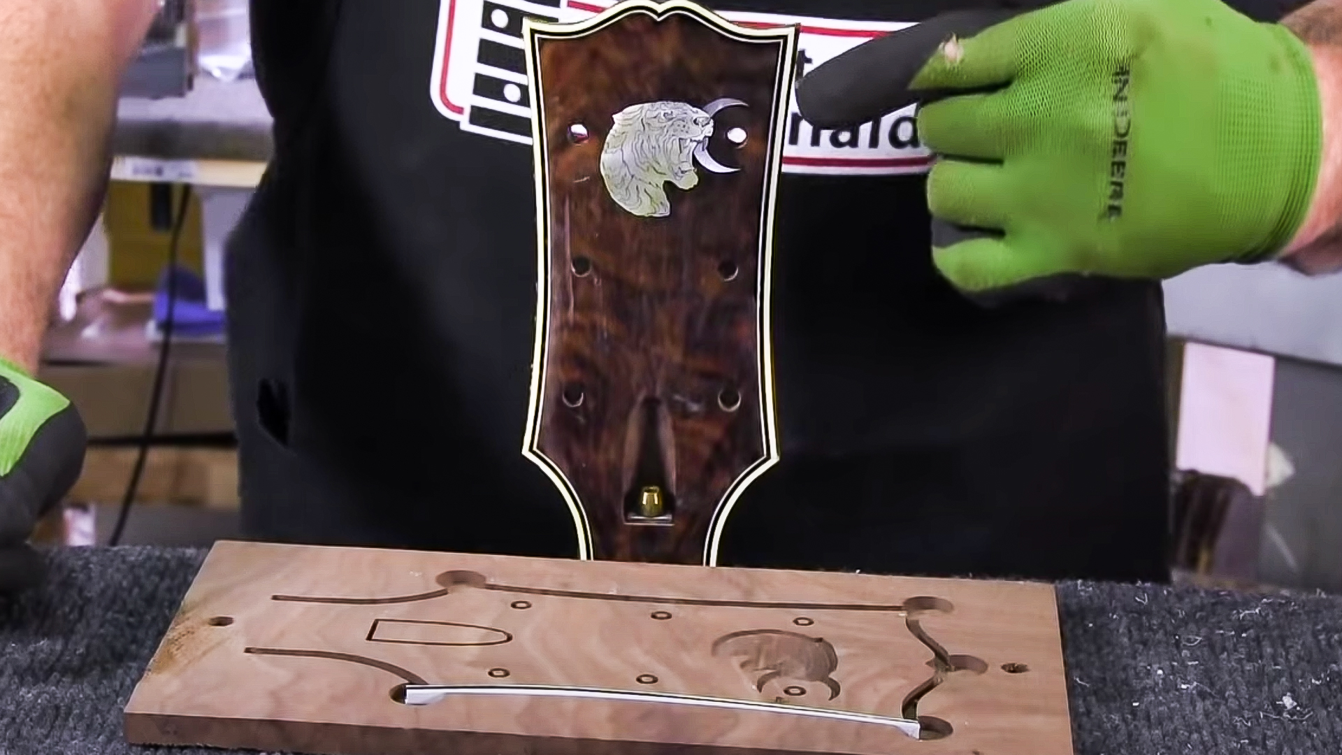 Neat trick for peghead binding (tiger inlay)