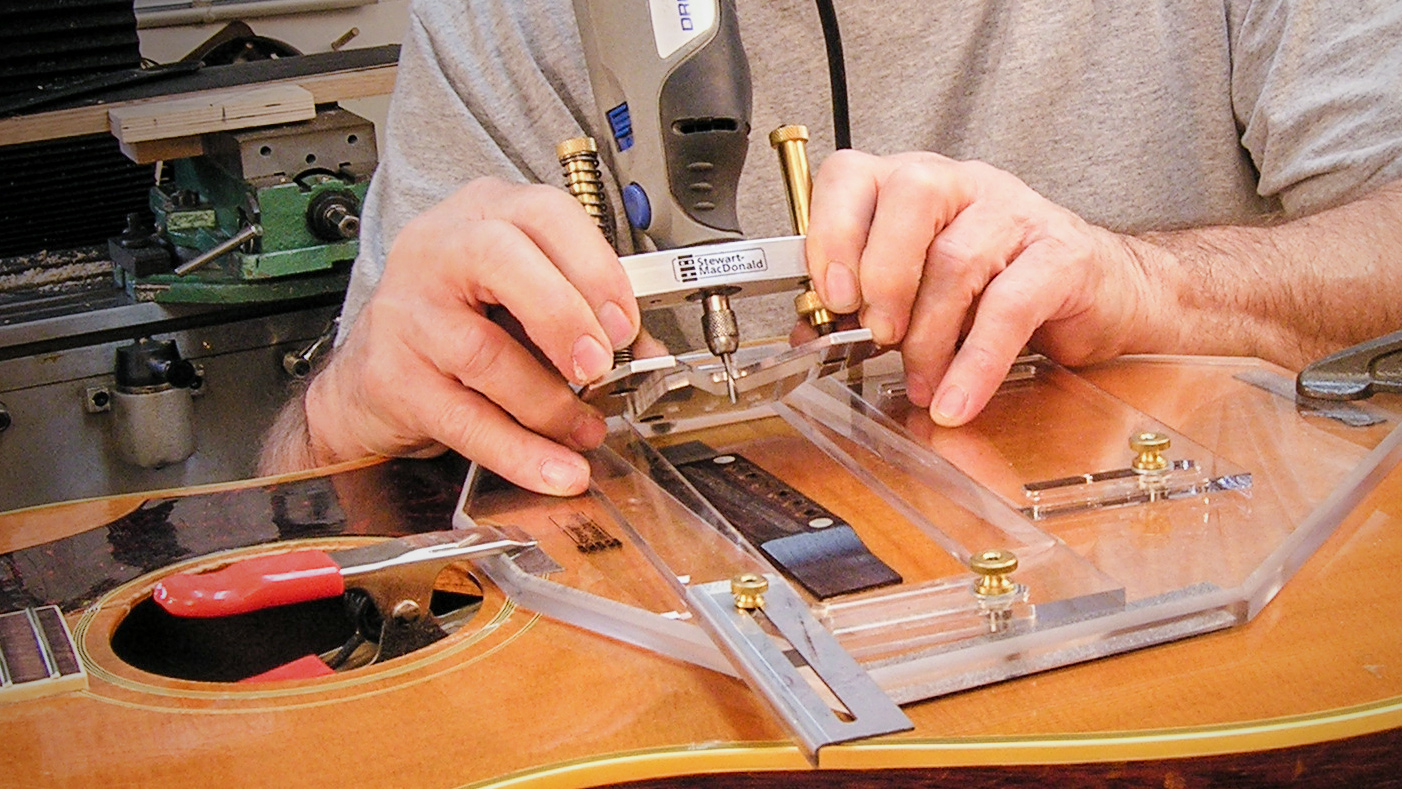 Finding the right location for a guitar's saddle slot