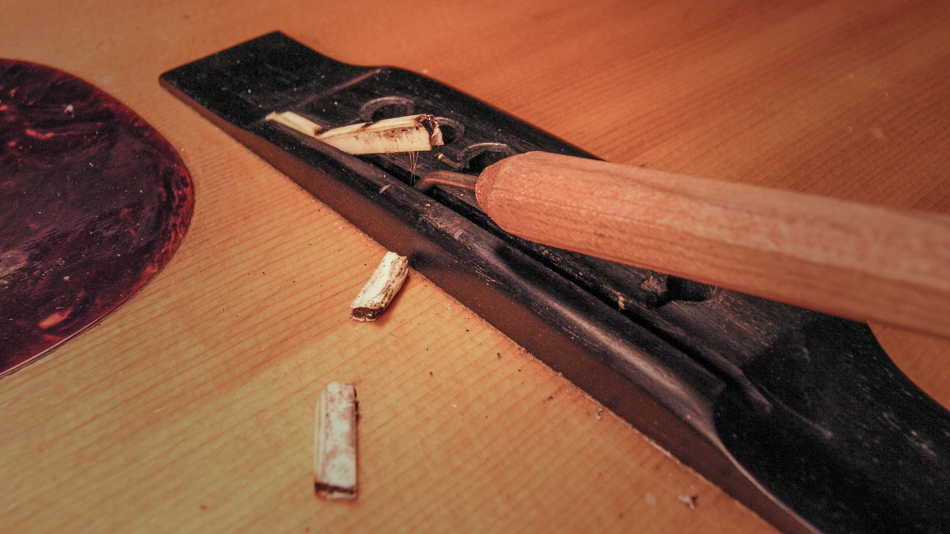 Removing the glued-in saddle on a 1937 Martin D-28 Herringbone