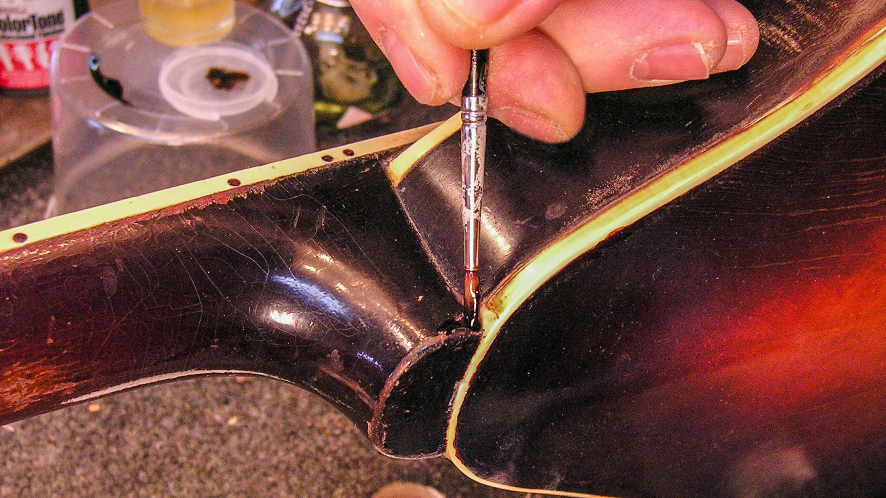 Adding color to hide glue for an invisible repair