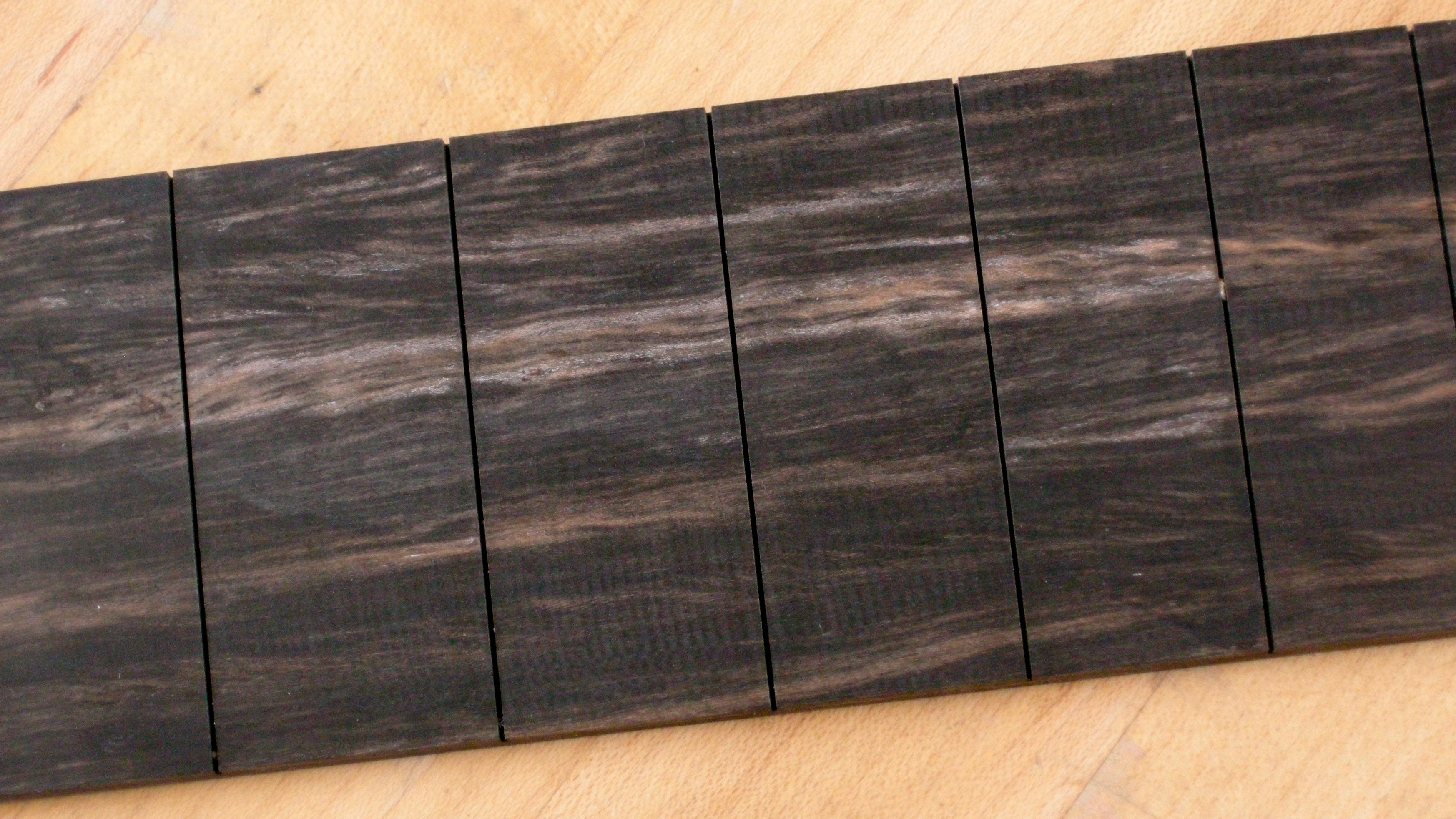 For ebony streaks, use black fingerboard stain