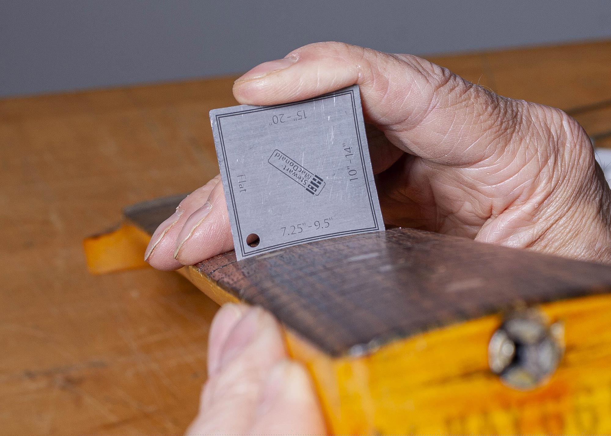 Measure fret slot depth.