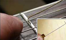 Bent string feeler gauge