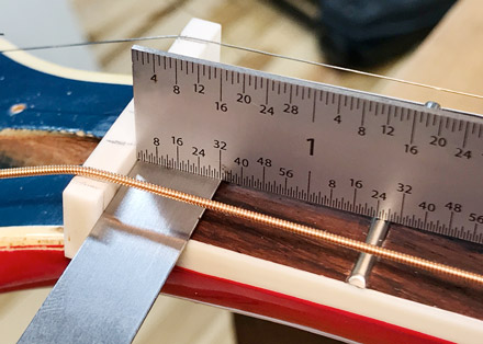 Measuring the fret height by stacking feeler gauges