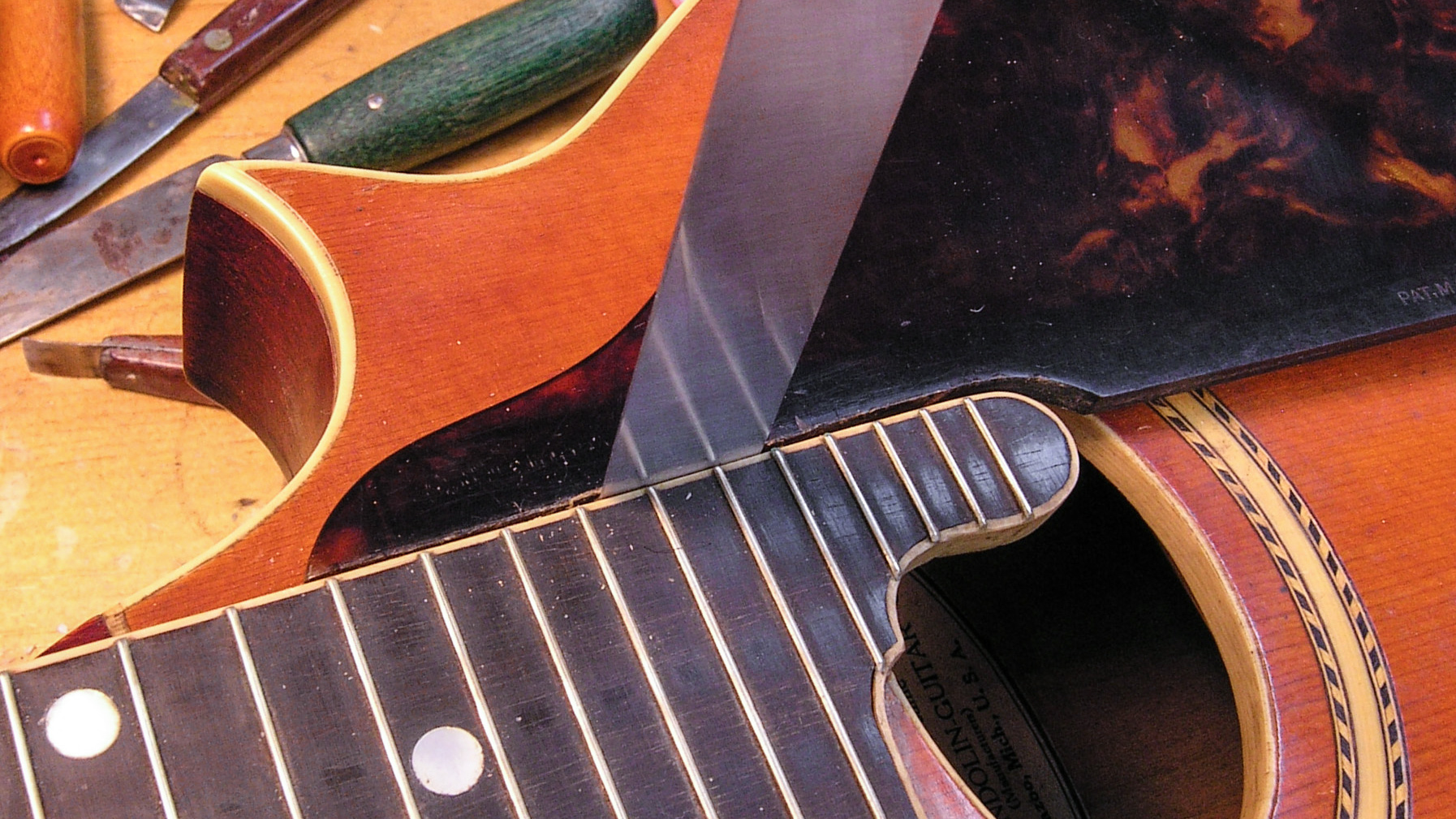 Straightening the neck on a 1914 Gibson mandolin