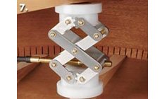 Press the brace into position and clean up glue squeeze-out