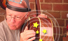 Dan tapping the guitar back