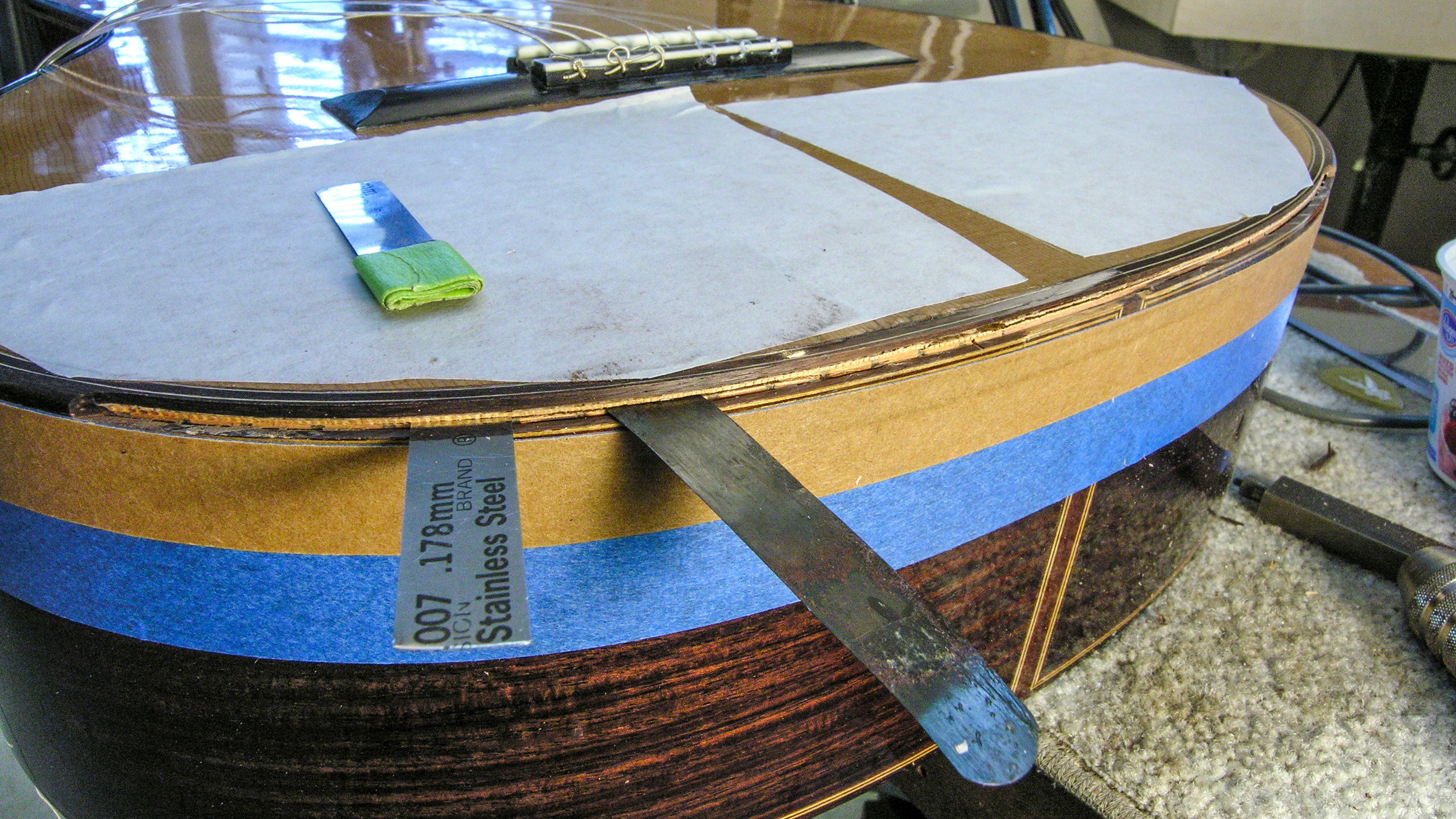 How to fix this guitar if my elbow's stuck in the soundhole?