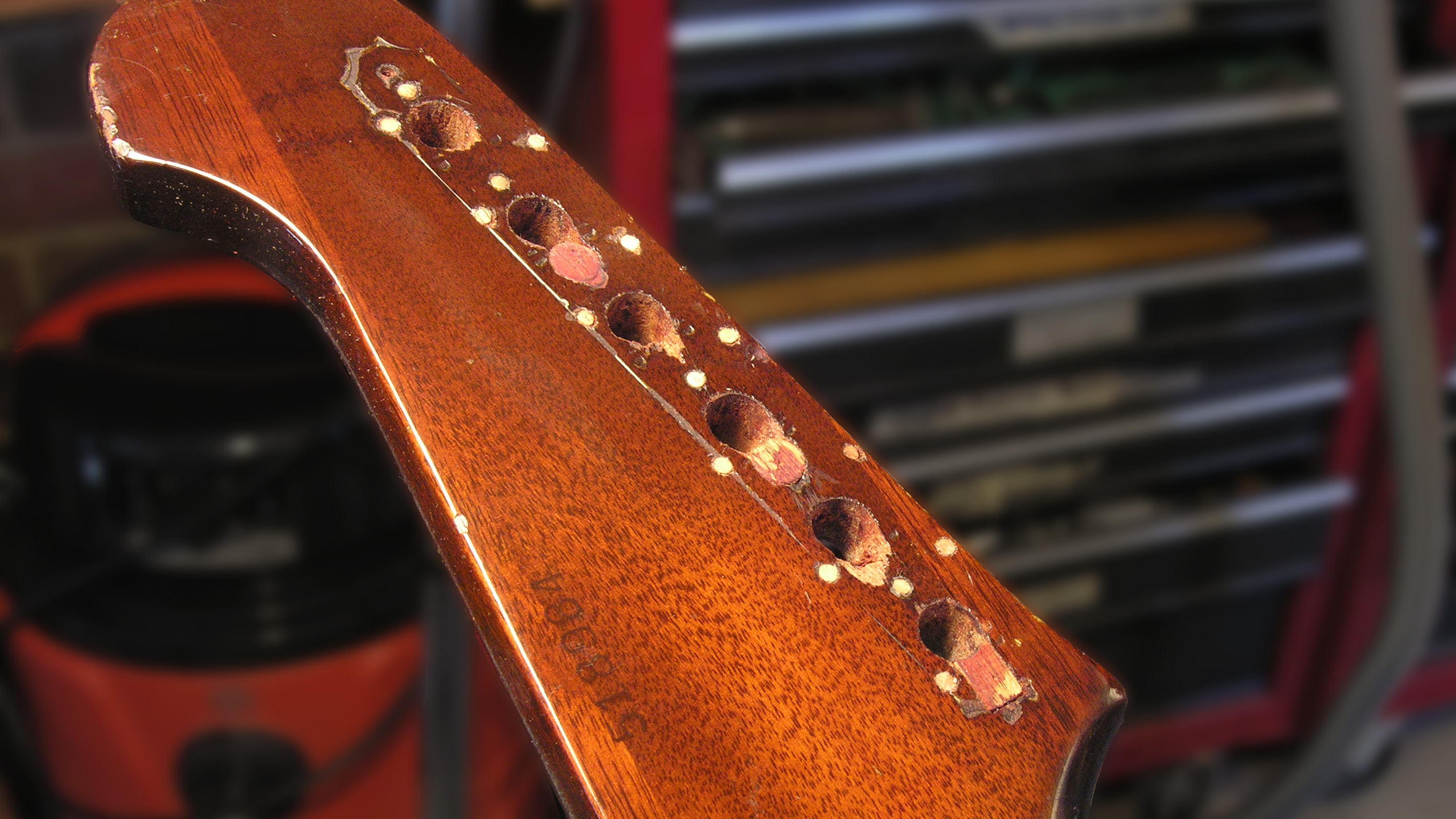 Fixing a 1965 Gibson Firebird with holes in its head!