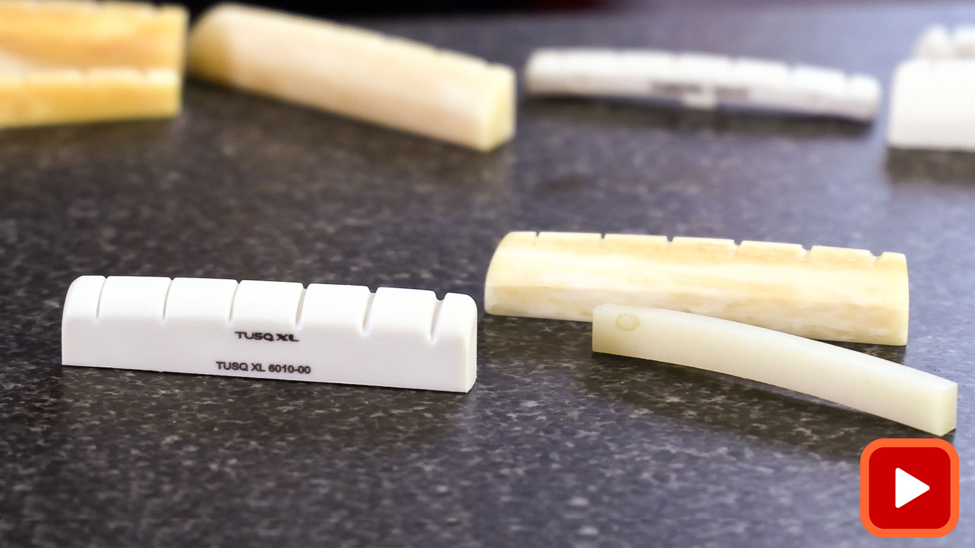 Nuts in multiple materials on granite slab