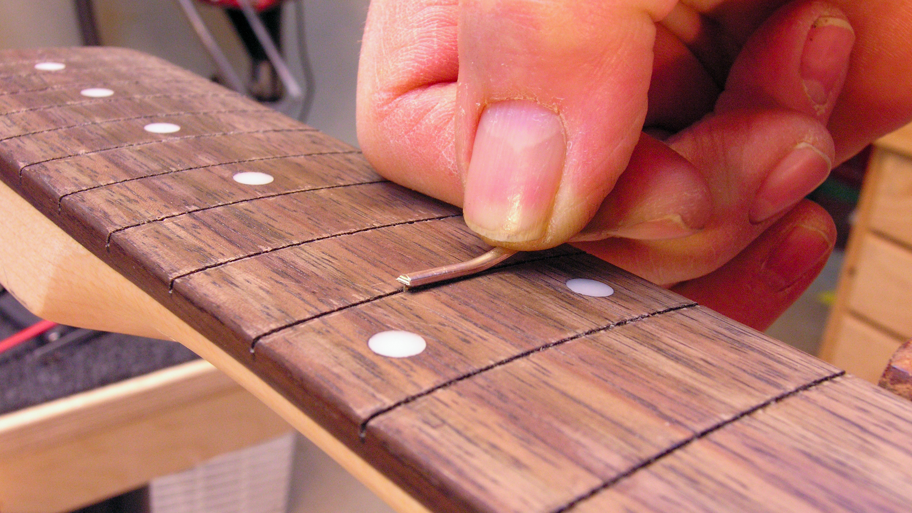 When frets don't fit the slot, resize the fret tang
